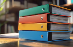 Stack of binders on a desk in a library